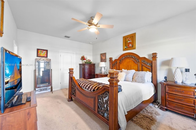 bedroom featuring light carpet and ceiling fan