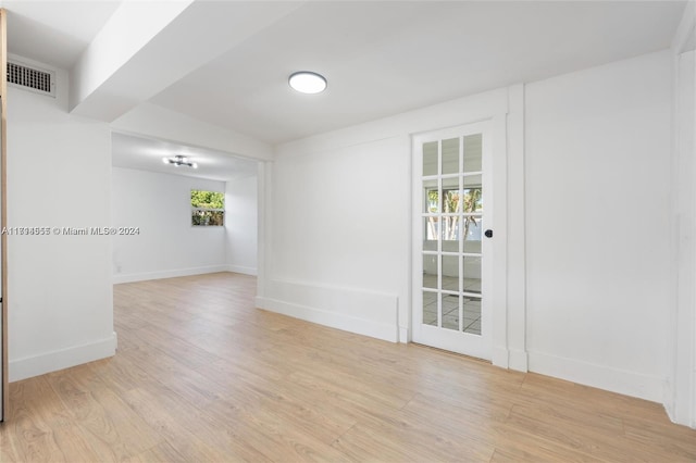 unfurnished room with light hardwood / wood-style floors