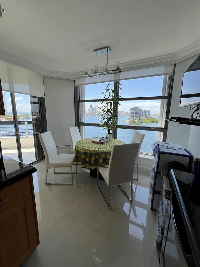 sunroom / solarium with a water view