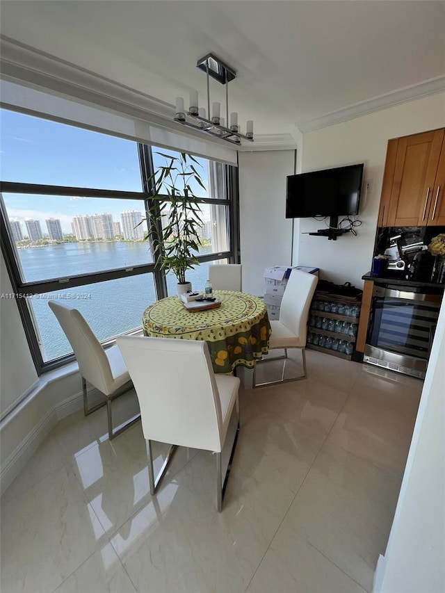 dining space with a healthy amount of sunlight and crown molding