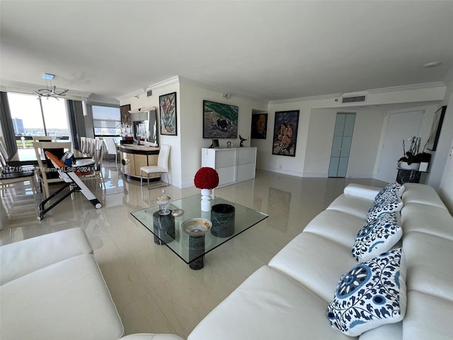 living room with ceiling fan and crown molding