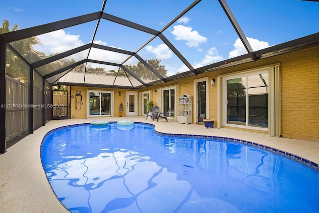 view of pool featuring a patio area and a lanai