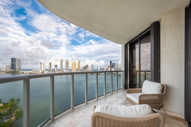 balcony featuring a water view