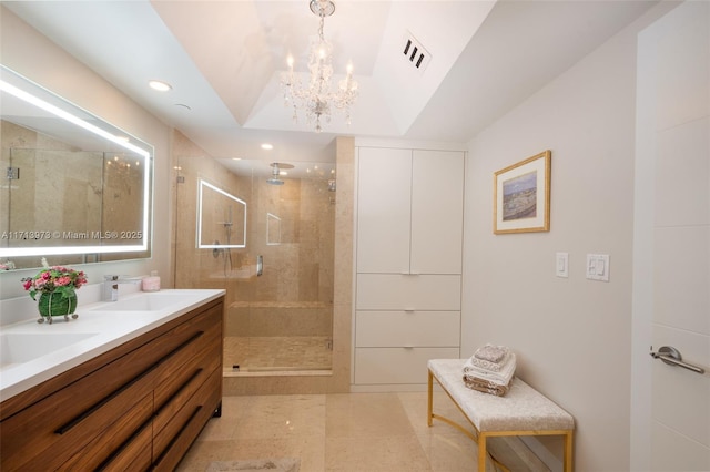 bathroom featuring vanity, lofted ceiling, and tiled shower