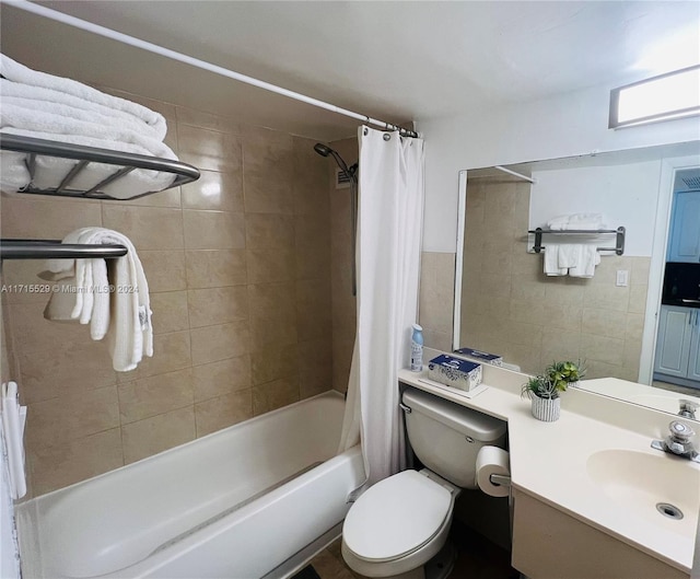 full bathroom featuring vanity, toilet, and shower / bathtub combination with curtain