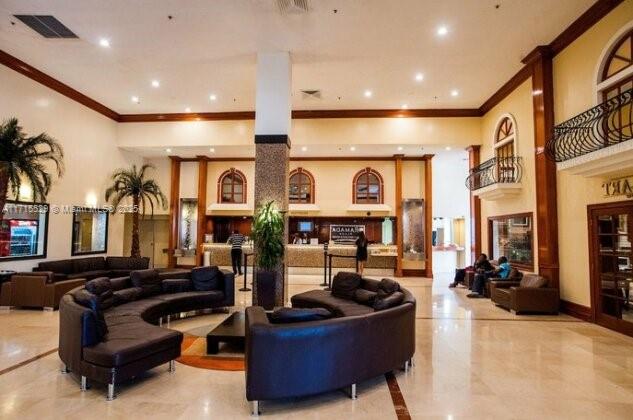 19201 Collins Ave Unit 1017, Sunny Isles Beach, FL 33160 - building lobby with ornamental molding, recessed lighting, and a high ceiling