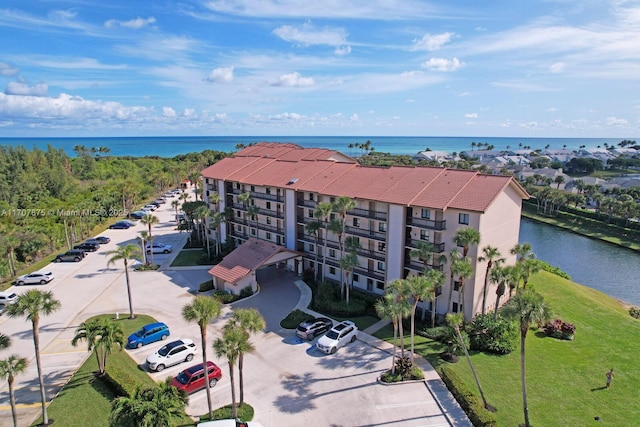 birds eye view of property featuring a water view