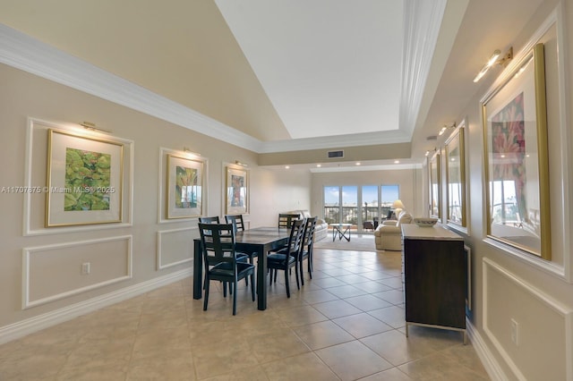 dining area with high vaulted ceiling and light tile patterned flooring