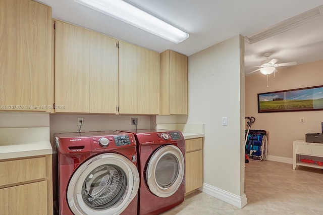 washroom with ceiling fan, cabinets, and separate washer and dryer