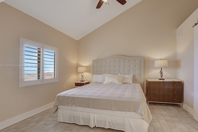 bedroom with light wood-type flooring, ceiling fan, and lofted ceiling