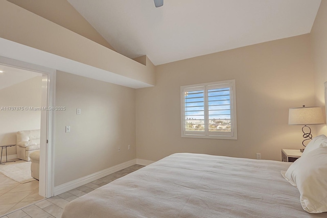 tiled bedroom featuring ceiling fan and lofted ceiling