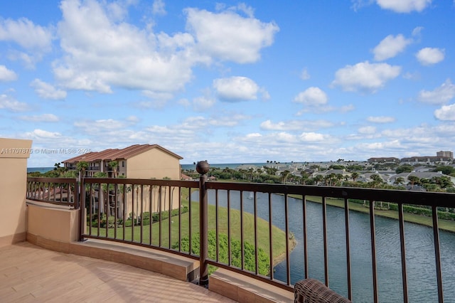 balcony featuring a water view