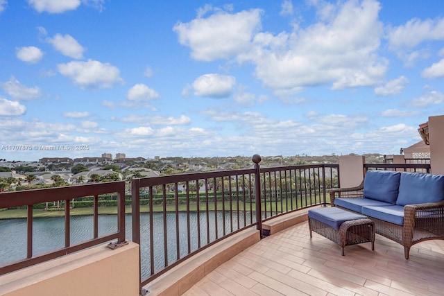 balcony featuring an outdoor hangout area and a water view