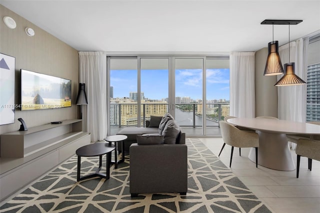 living room featuring tile patterned floors and expansive windows