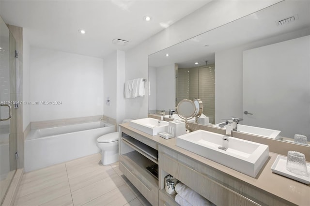 full bathroom with tile patterned floors, vanity, independent shower and bath, and toilet