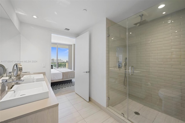 bathroom with vanity, tile patterned floors, and an enclosed shower