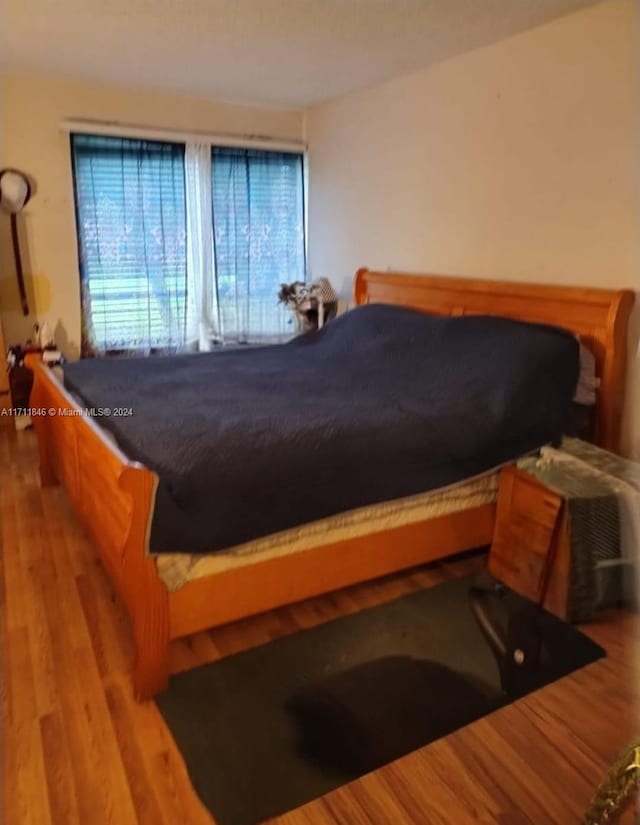 bedroom featuring hardwood / wood-style flooring