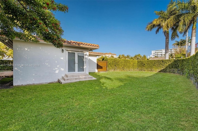 view of yard with french doors