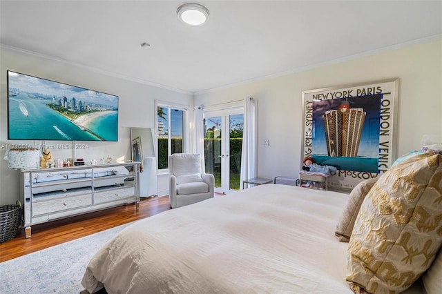 bedroom featuring access to exterior, french doors, hardwood / wood-style flooring, and ornamental molding