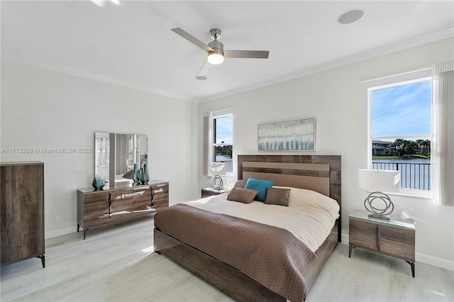 bedroom with ceiling fan, multiple windows, and light wood-type flooring