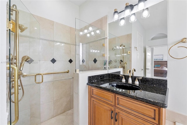 bathroom featuring vanity, tile patterned floors, and an enclosed shower