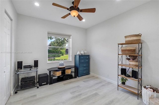 home office featuring ceiling fan and light hardwood / wood-style floors