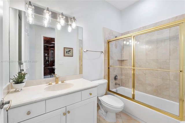 full bathroom with toilet, tile patterned flooring, enclosed tub / shower combo, and vanity