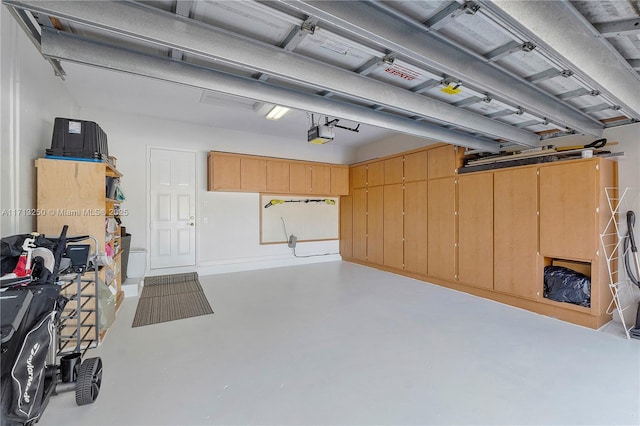 garage featuring a garage door opener