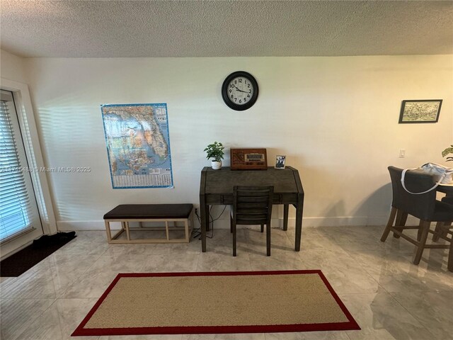 interior space featuring a textured ceiling