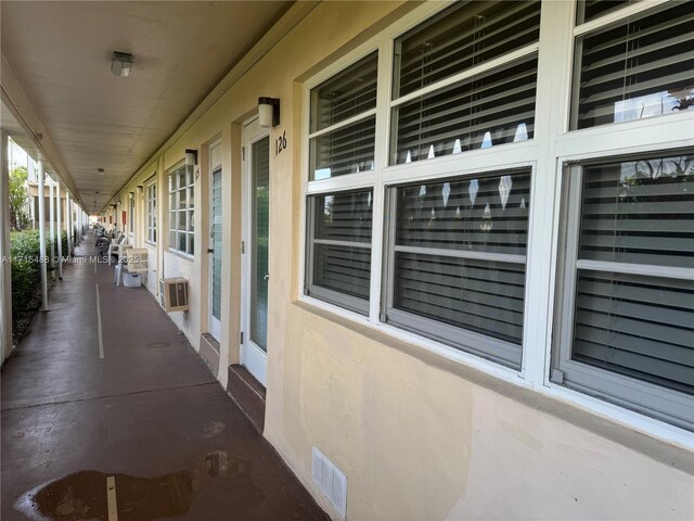 view of patio / terrace featuring a wall mounted air conditioner