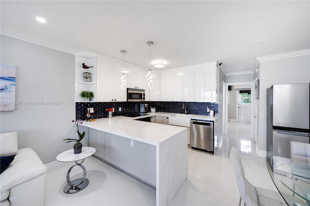 kitchen featuring white cabinetry, stainless steel appliances, tasteful backsplash, kitchen peninsula, and decorative light fixtures