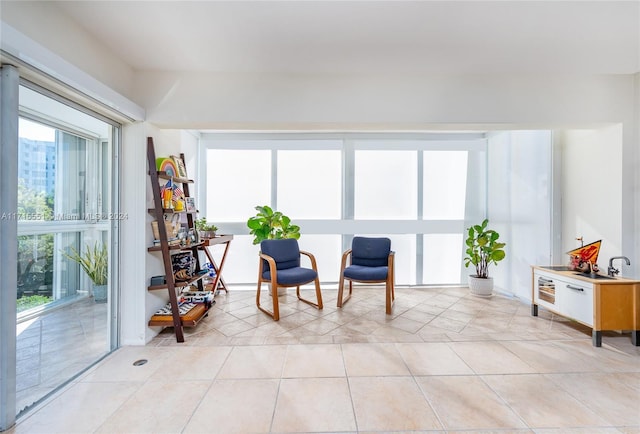 sitting room featuring light tile patterned floors