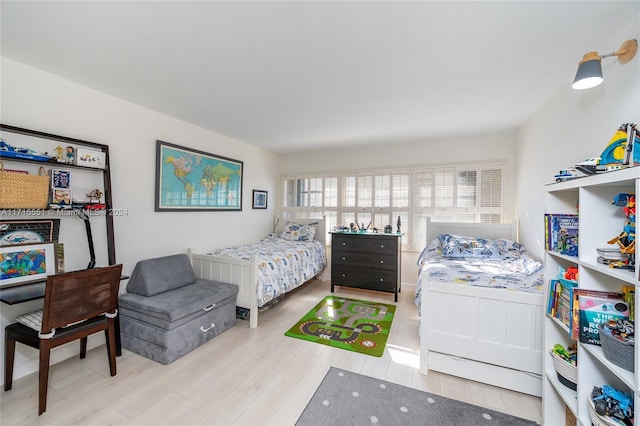 bedroom with light wood-type flooring