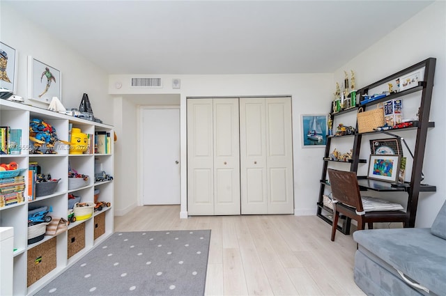 sitting room featuring light hardwood / wood-style flooring