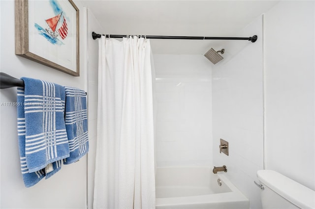 bathroom featuring toilet and shower / tub combo with curtain