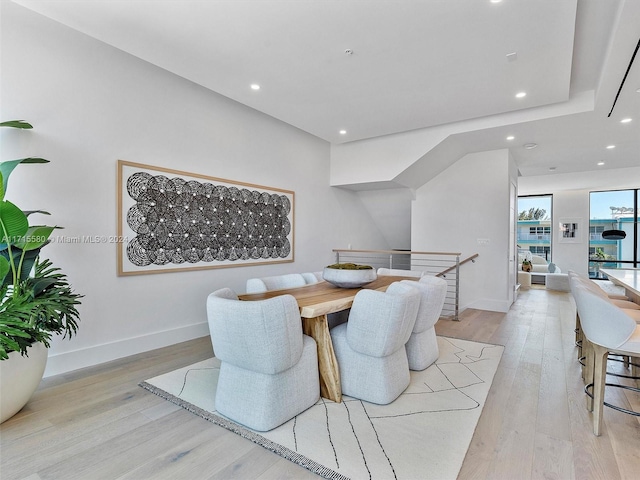 dining space with light wood-type flooring