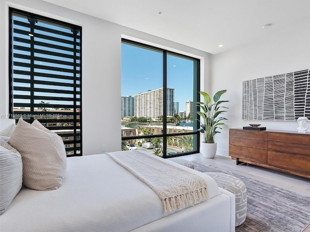 bedroom with hardwood / wood-style flooring