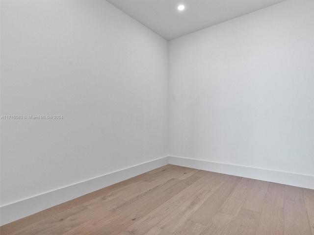 unfurnished room with light hardwood / wood-style floors