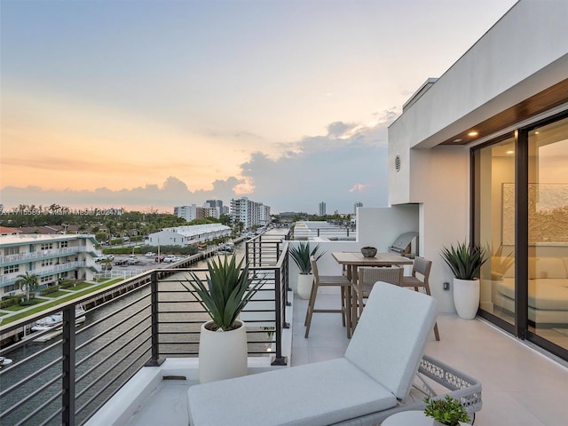 view of balcony at dusk