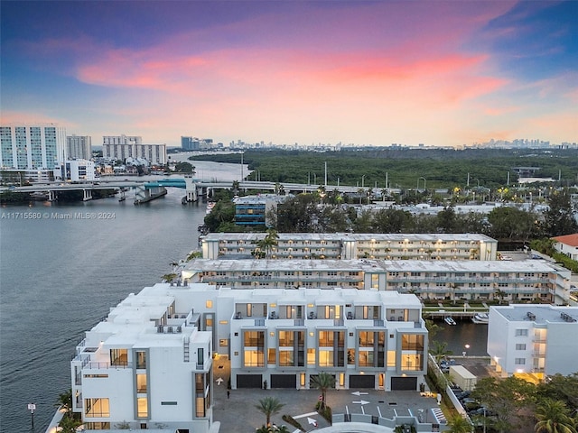 aerial view at dusk with a water view