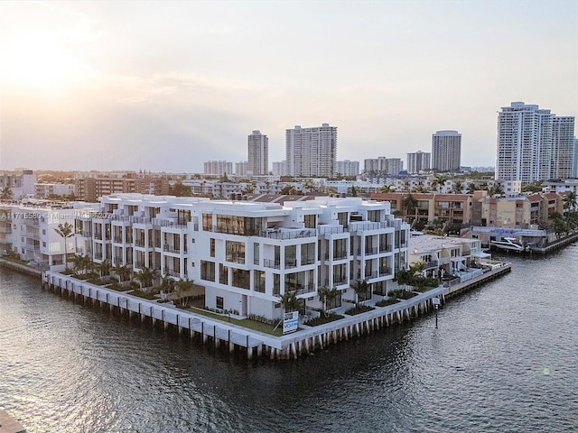 aerial view at dusk with a water view