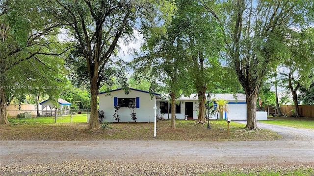 view of front of property featuring a garage