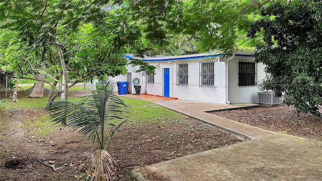 view of front of property featuring central air condition unit