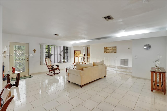 living room with light tile patterned flooring