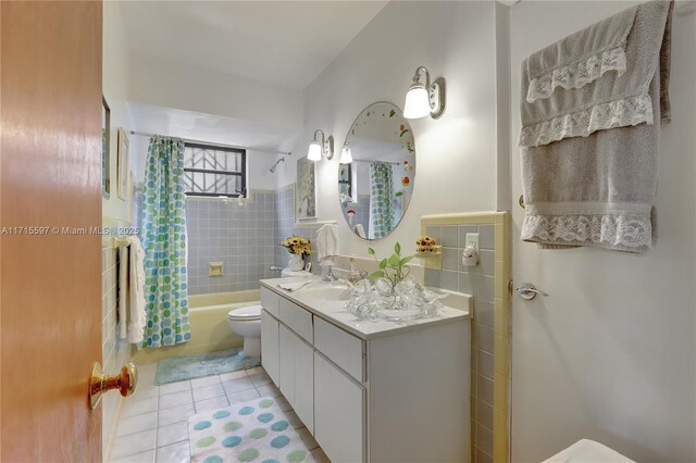 full bathroom featuring tile patterned flooring, shower / bath combination with curtain, toilet, and vanity