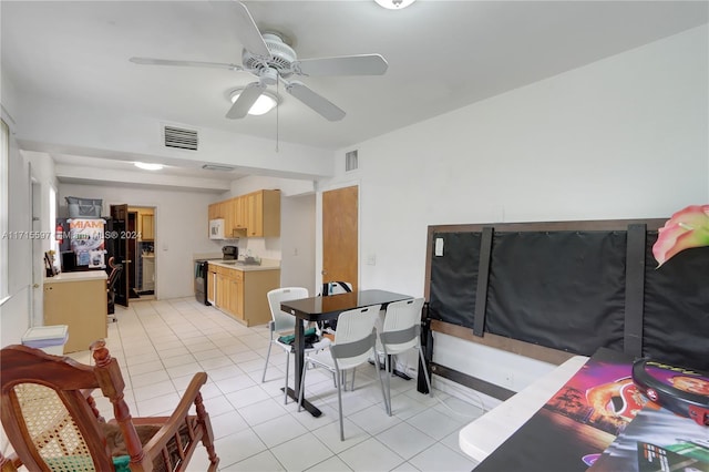 tiled dining room featuring ceiling fan