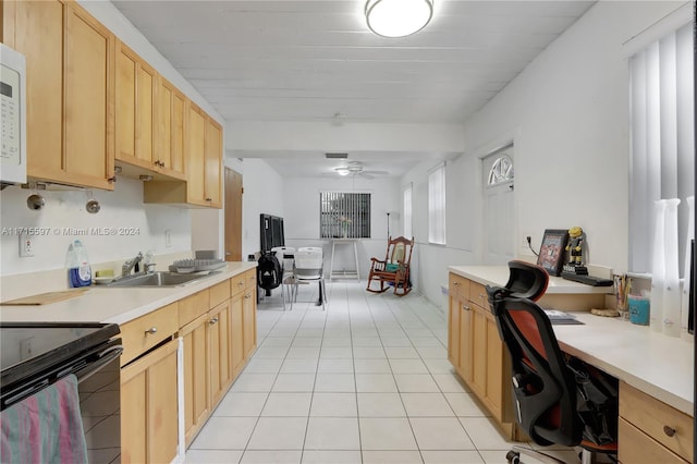 kitchen with ceiling fan, light brown cabinets, light tile patterned flooring, and sink