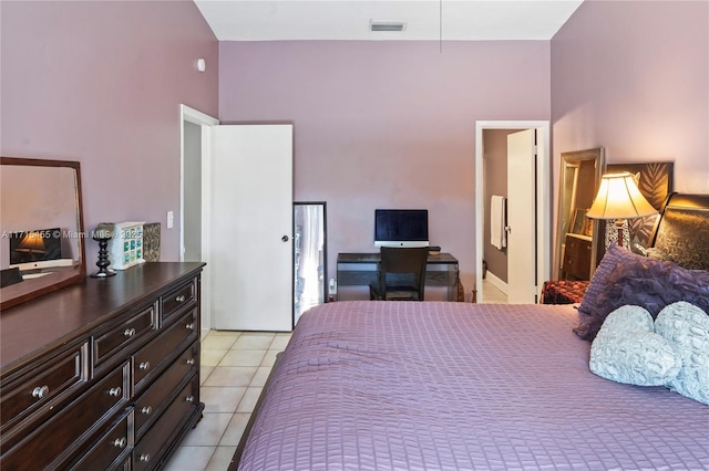 bedroom featuring visible vents and light tile patterned floors