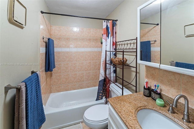 full bath featuring toilet, tasteful backsplash, shower / bath combo, and vanity