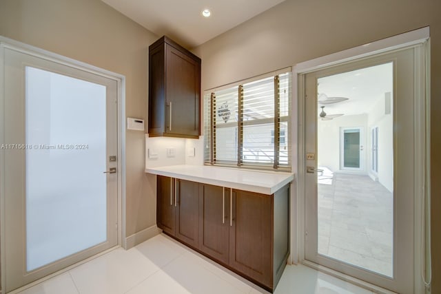 kitchen featuring ceiling fan and light tile patterned floors